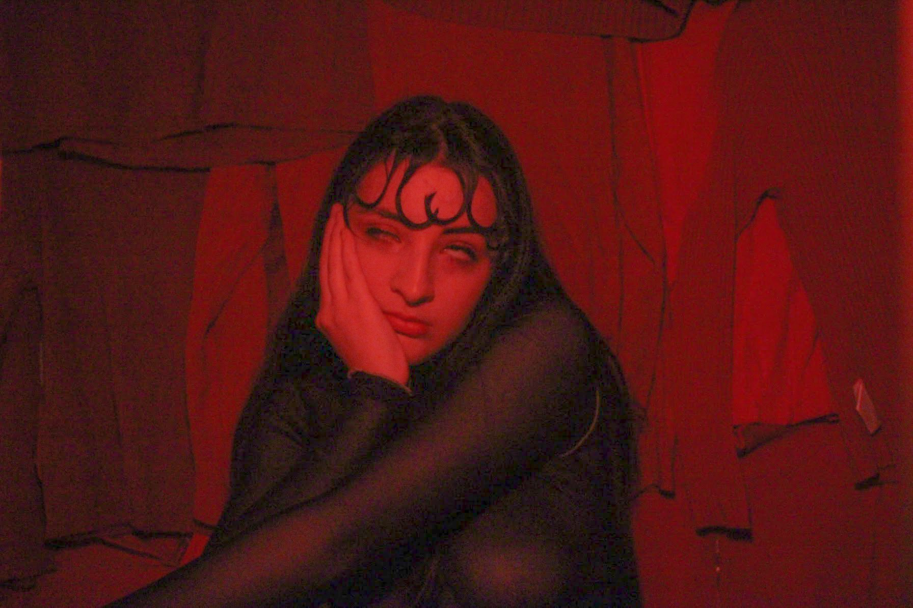 A woman rolls her eyes with her hand on her face all in red.
